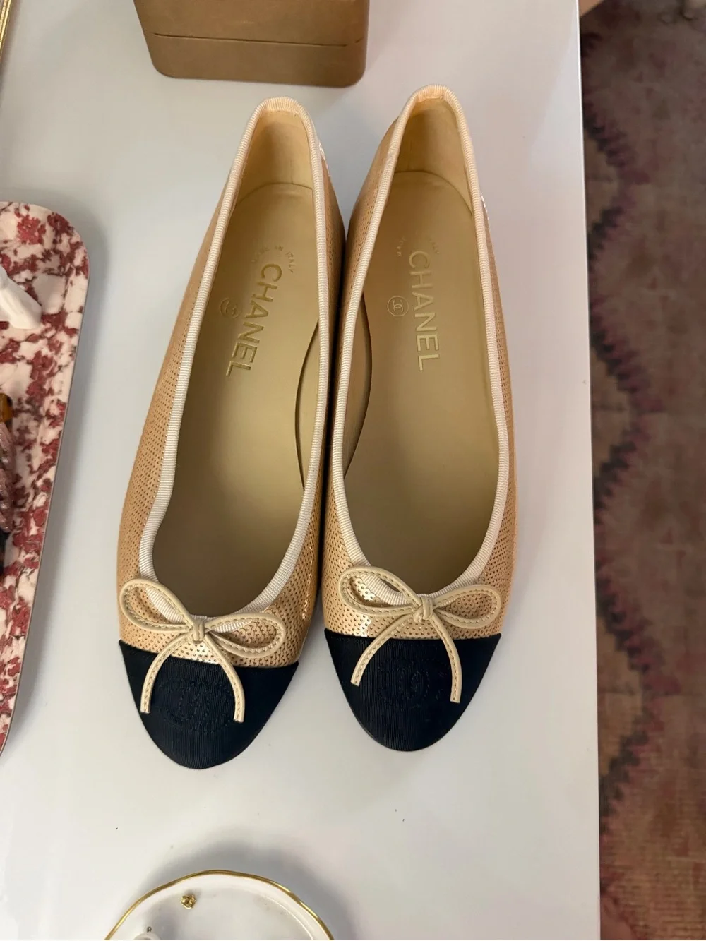CHANEL Beige and Black Cap-Toe Ballet Flats with Bow